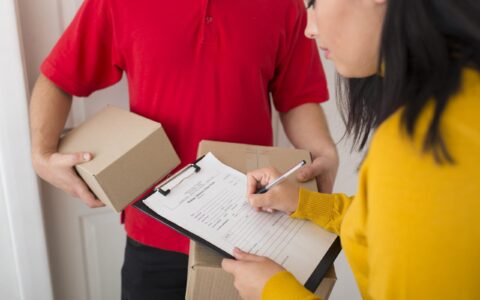 side-view-woman-signing-delivery-paper